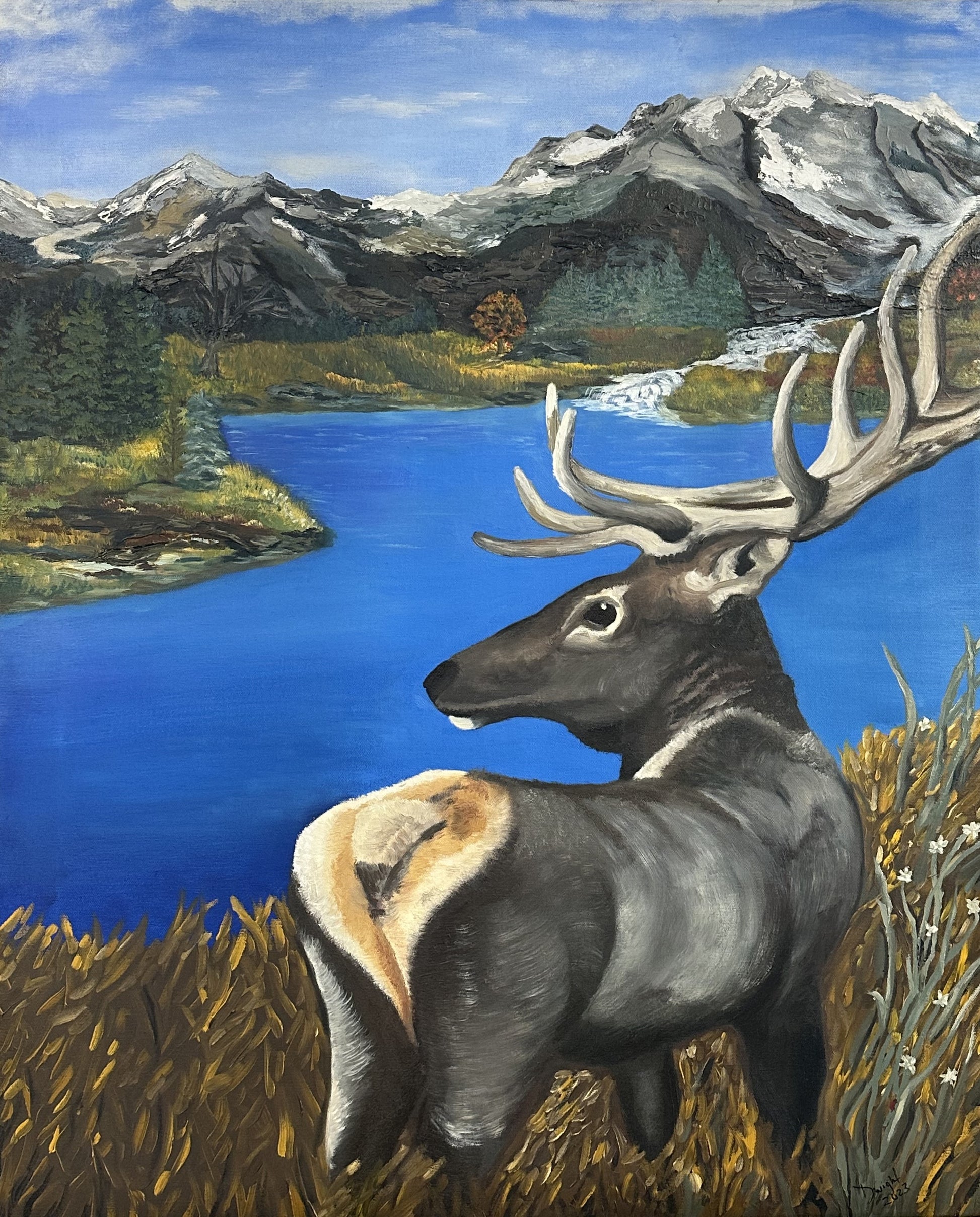 Elk standing by a Mountain Lake
